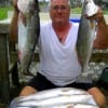 Winnie angler Ricky Tribble hefts 9.5 and 8.5 specks from his catch of specks with the smallest at 7.5 lbs--