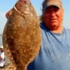 Dennis Boeker of High Island landed this nice flounder on finger mullet-