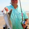 Bart Birdwell of San Augustine waded the surf to catch his supper of specks.