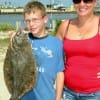 Everett Sunday with aunt Brandie of Conroe took this doormat flounder on Gulp.