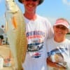 Steve Thornhill and Alice Dykes of Lufkin heft their 24inch red caught on finger mullet-