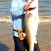 Barry Culbertson of Lufkin, TX surf caught and released this 53inch Bull Red on cut mullet.