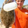 Justin Knight of Lumberton, TX hefts a nice flounder caught on Gulp.