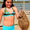 Soon to be 10yr old Jasmine Reynolds of Elysian Felds, TX nabbed this 20 inch flounder on Miss Nancy's Finger Mullet.
