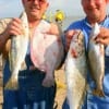 Larry King of Kirbeyville and Rick Evan of Orange took these nice specks and flounder on live shad.