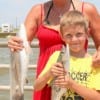 Sherri Dailey and 8yr old Thomas Norman of Gilchrist caught soanish mackerel and trout on live shad.