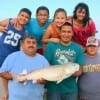 The Herevia familia gathered to see Adrians 34inch tagged redfish.