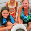 The Edwards and Reynolds family teamed up to catch a bucket of crabs for supper.