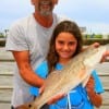 Grandpa Alan Edwards with grandaughter Jasmine displays his nice red caught on Lil'Fishy.