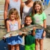 The Brandon family from Hardin, TX  have 21 and 24inch specks they caught on live shad-.