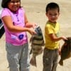 The Chang kiddos of College Station, TX nabbed these nice drum and flounder for dinner.