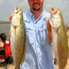 Cory Bunyard of Pearland nabbed these two nice trout on finger mullet.