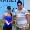 Ximena and Oscar Viteri of Ecuador show off their Rollover Pass catch.
