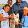 The Johnson Family of Houston heft their nice drum catch caught on shrimp.