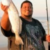 Larry Webster of Missouri City, TX fished the surf with live croaker for this 20inch speck-