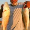 Louis Green of Missouri City took these big reds on finger mullet.
