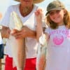 Grandma Bobbie West with Grandaughter Sydnee caught this nice speck and red on finger mullet.