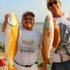 Fishin buds Robert Saldana and Dennis Gibson of Houston took these nice reds on finger mullet.