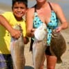 Angela Mouro with son Nicolas took these nice reds and flounder on finger mullet.