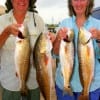 Becky Gary of Deerpark and Ann Curry of Pasadena Kayaked bay grass to catch these chunky redfish on finger mullet.