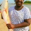 Dorothy Smith of Lakewood TX hefts this nice red caught on shrimp.