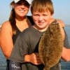 Branden Clfton; with a little help from mom Kay,shows off his nice flounder.