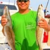 Daniel King of Dayton, TX waded the surf fishing live croaker for these 22inch specks.