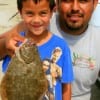 Angel Tello of Alvin, TX caught his first flounder with the help of Dad, Jose.