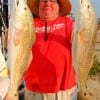 Isa Holland of Houston nabbed these two tagger reds onfinger mullet.