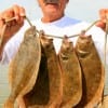 Henri Fontenot of Dallas took these keeper flounder on finger mullet.