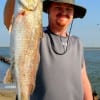 Mark Smith of Baytown, TX put this nice red in the box fishing finger mullet.