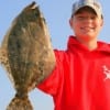 Tyler Doyle of Livingston, TX took his very first flounder here at rollover pass.