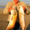 Sam Walwrath of Goodrich, TX night-fished with cut-bait to nab these big reds.