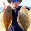 Curtis Howard of Huntsville TX took these 2 flounder on finger mullet.