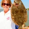 Flounder pounder Kim Aldy of Baytown, TX shows off her 19inch flounder she caught on finger mullet.