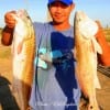 Dai Vu of Katy, TX rounded up these two reds fishing live shrimp.