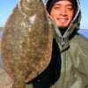 Simon Torres of Houston fished soft plastics for this 16 inch flounder.