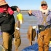 Rollover Bay waders Rob Harmen and Tim Janish of houston fished mud minnows and live shrimp to catch these fine stringers of flounder and reds.