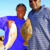 Married 46 years George and Essie Harrison of Houston celebrated by catching this flounder and drum at Rollover.