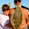 Tommy Bell and Terri Pipps hugged this keeper flounder for supper.