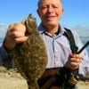 Author of Childrens books www.Carlsomer.com wade-fished for this keeper flatfish using finger mullet.