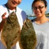 Johanna and Gummi Lam of Houston double caught these nice flounder on cut bait.