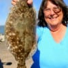 Houstonian Joyce Linton hefts this nice flounder caught on a Berkley Gulp.