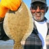 Retired Marine (35yrs) Ulysses Blank of Houston caught this nice flounder on Berkley Gulp.