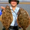 Michael Thompson of Pearland, TX limited with these two pounder flounders fishing Berkley Gulp.