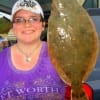 Brandy Racy of Spurger, TX caught her very first flounder at Rollover Pass.