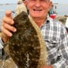 Hughie Singleton of Winnie, TX took this 20 inch flatfish on finger mullet.