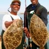 Bay waders GG Randolph of Liberty and Dwayne Raye Commier of New Orleans LA fished berkley gulps for these 22 and 21 inch flounder.