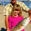 Gramps helps Katie Allison with her first ever redfish catch at Rollover.