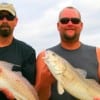 IMG_0031- Zeb Roberts and Chuck Krejchi of Salt Lake City UT heft these two nice slot reds caught on shrimp-